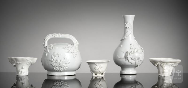 A group of Dehua porcelains: three wine cups, jug and vase